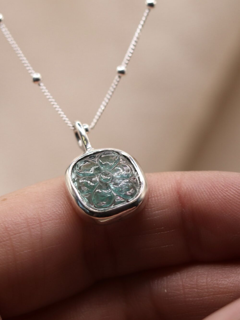 Carved emerald flower