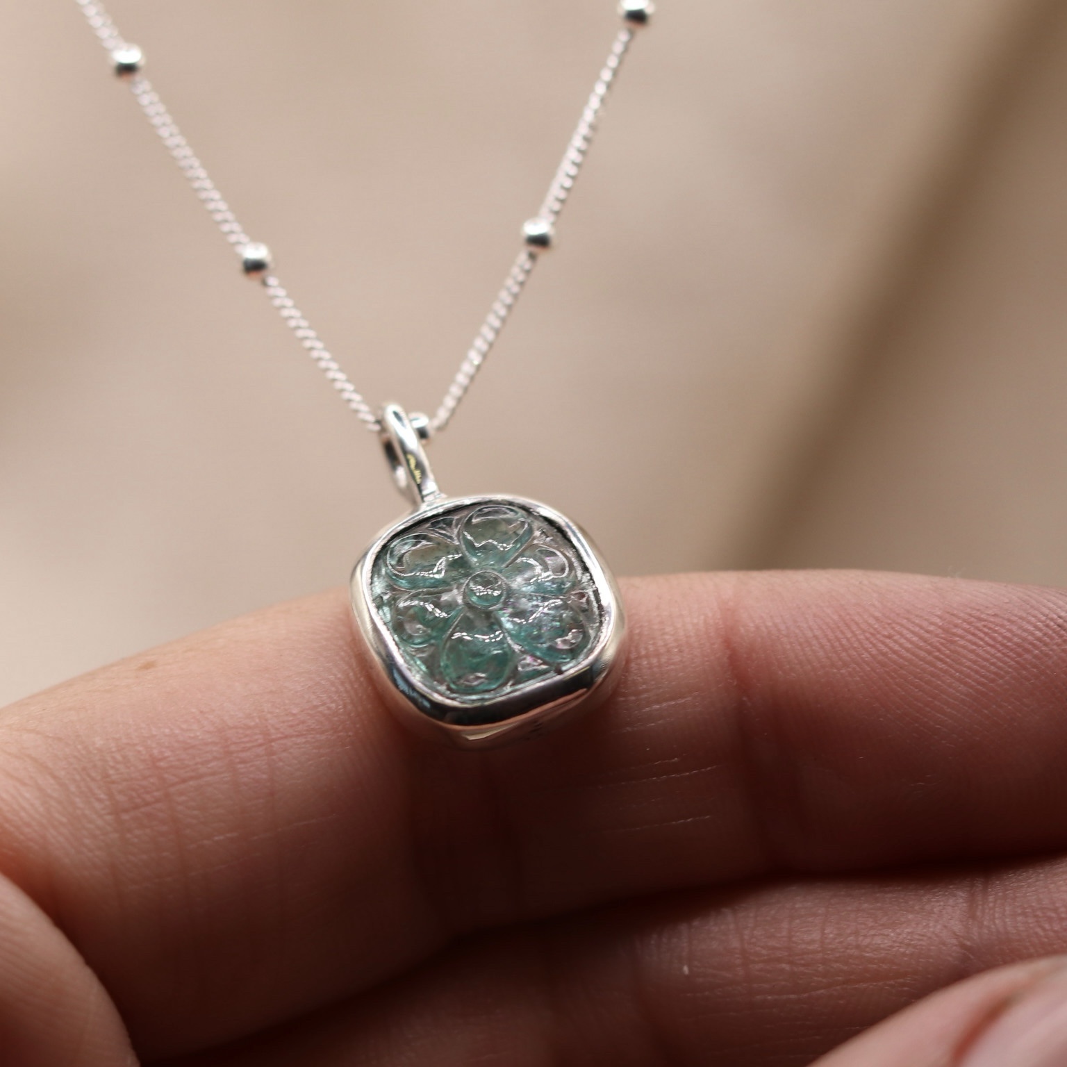 Carved emerald flower